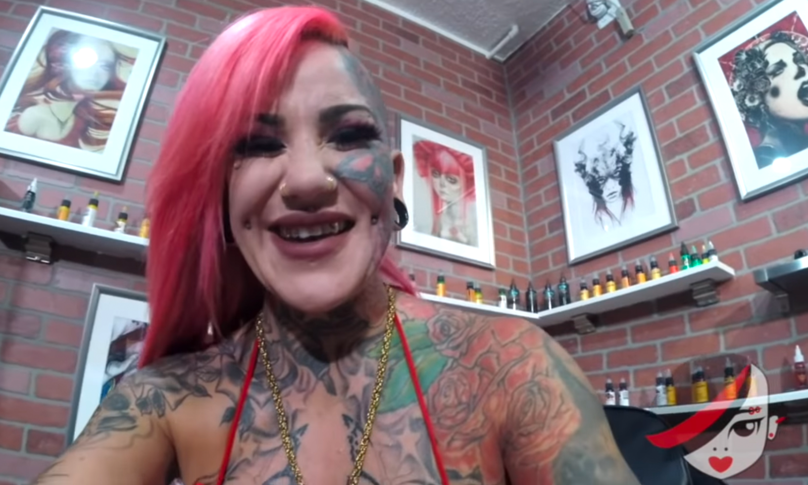Evilyn Ink Delivers Scene Tattooing Alt Erotic's Logo on Herself