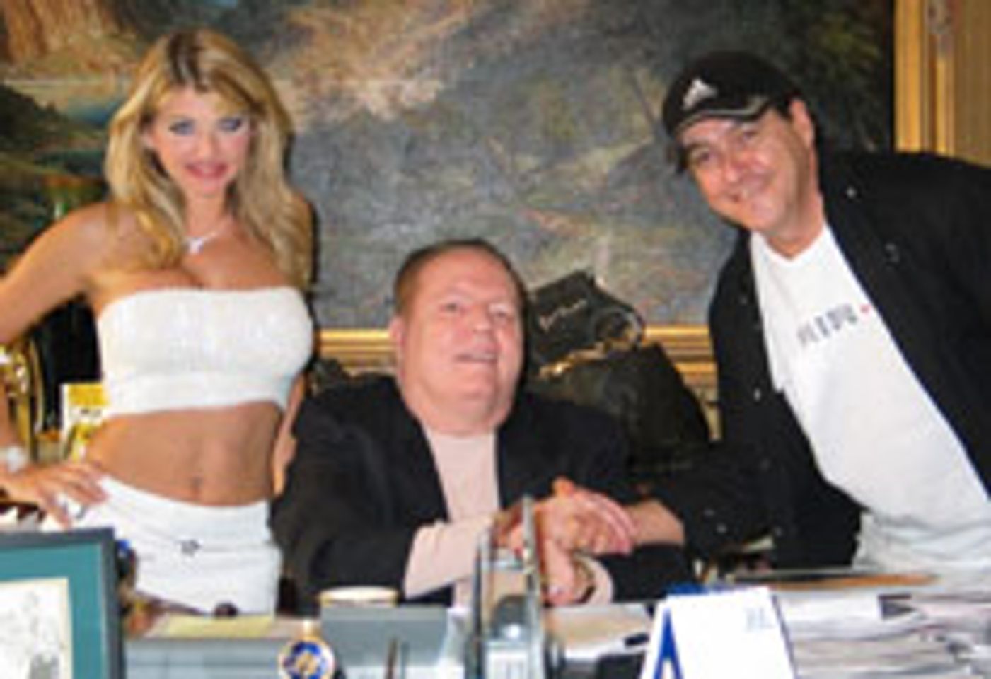 Larry Flynt Hands Vicky Vette Her Check for Winning Beaver Hunt