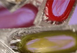 Condom Pins Make Splash at AIDS Conference